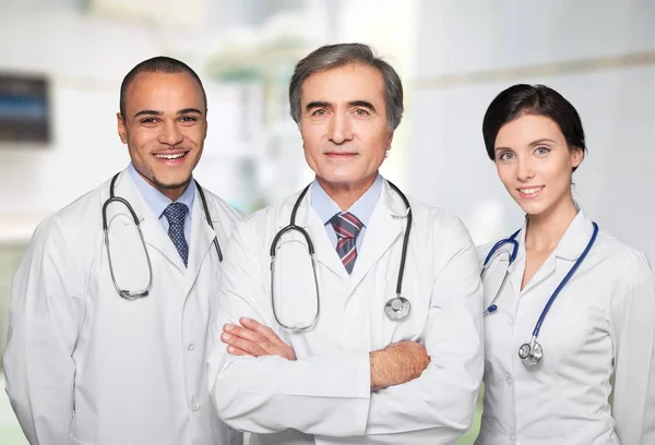 doctors with stethoscopes on background