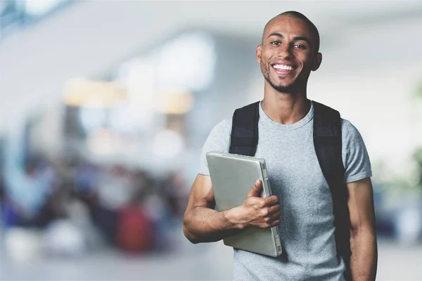 Smiling student man with laptop — Stock Photo, Image