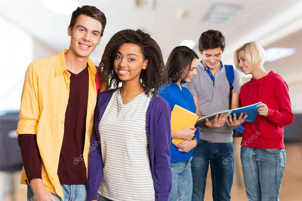 group of university students on blurred background 