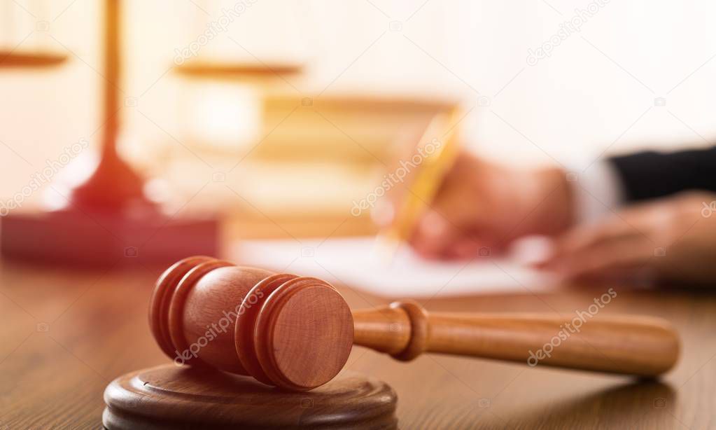 close of judge gavel on wooden table