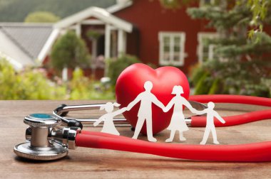 medical stethoscope, red heart and family model  clipart