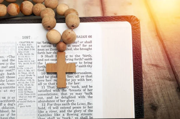 Holy Bible book and cross on  background