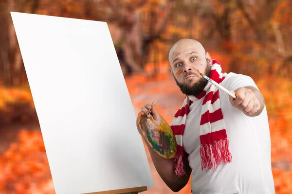 Male artist with paintbrush