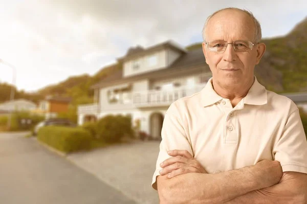 senior man with crossed arms