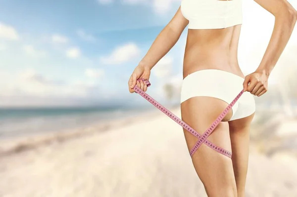 Young Woman Bikini Measuring Leg Beach — 图库照片