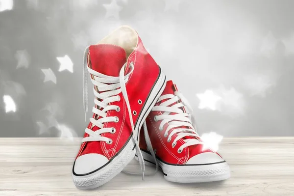 Pair of red gum shoes, close-up view