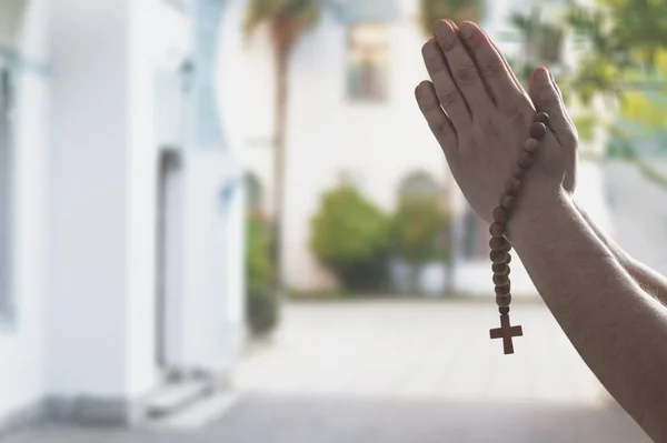 Hands of human praying, close-up view