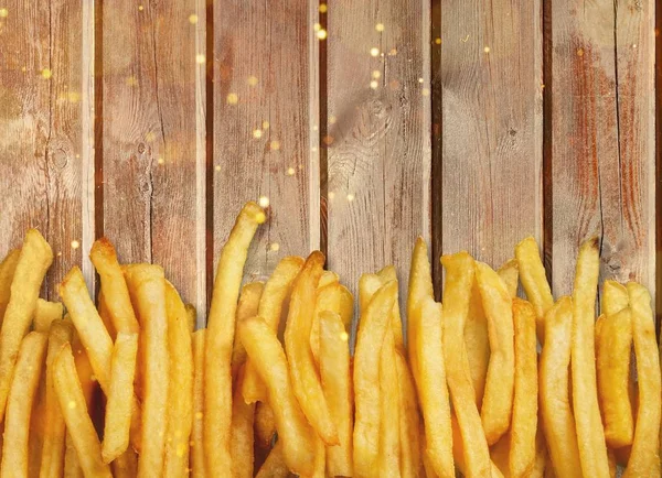 frame of French Fries on wooden table