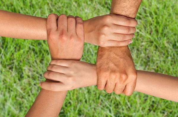 Four Hands Hold Each Other — Stock Photo, Image