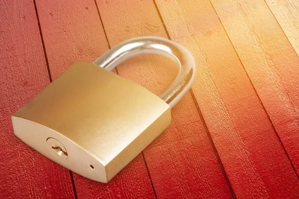 padlock on the wooden table background