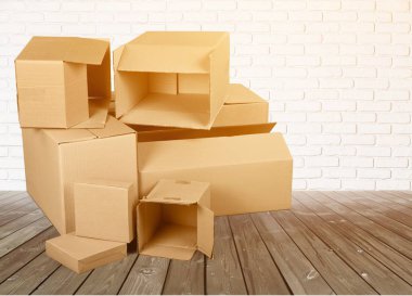 pile of cardboard boxes on wood background