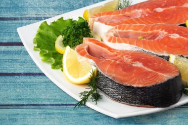 fresh salmon fish and lemon ready for cooking