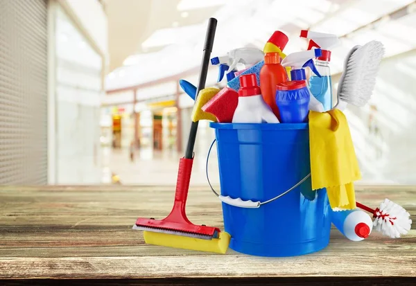 different cleaning supplies , household items