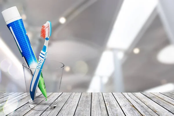 Toothbrush Toothpaste Glass Light Background — Stock Photo, Image