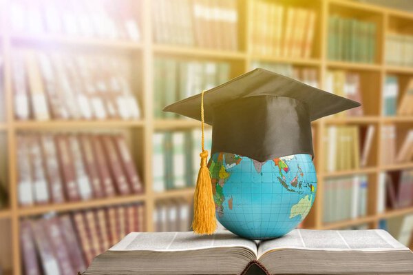 School stationery composition. globe on table and book