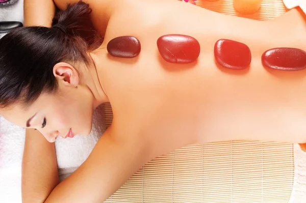 Beautiful Young Woman Getting Stone Therapy — Stockfoto