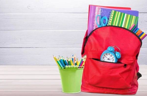 School Backpack with stationery, back to school background