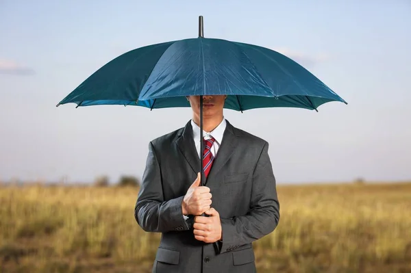 Young Businessman Holding Umbrella — Stock Photo, Image