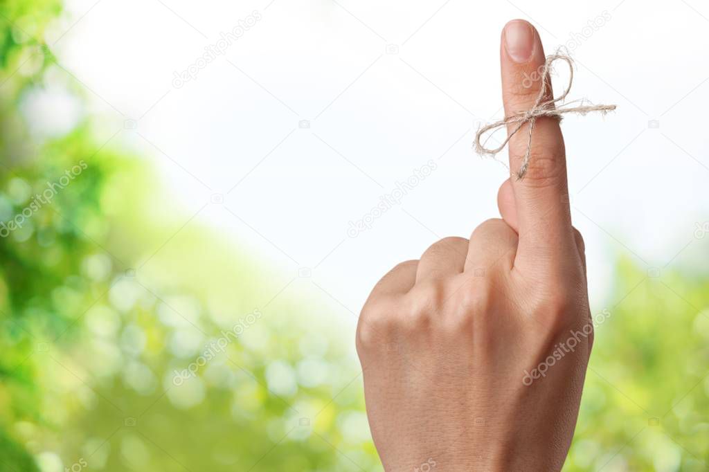 Index finger tied with rope