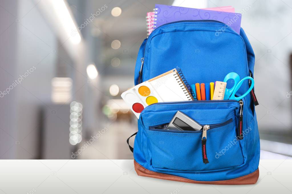 School Backpack with stationery, back to school background