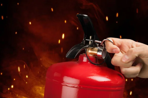 Red Fire extinguisher on background