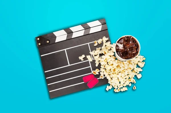 Movie clapper board, popcorn and cola. Movie objects set