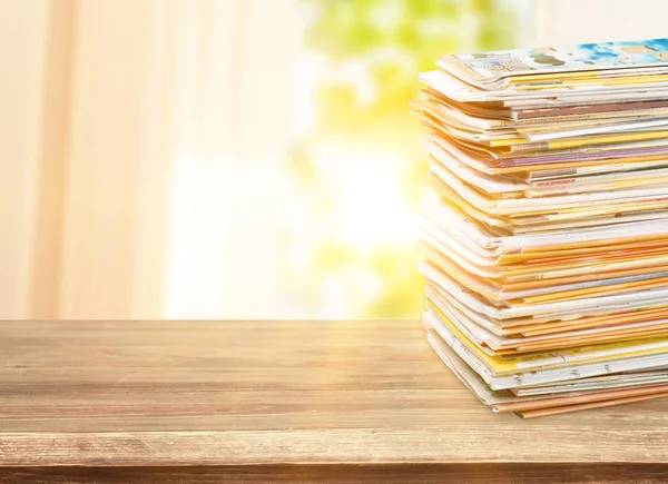 stack of old folders on wooden table