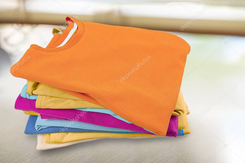 stack of colorful t-shirts