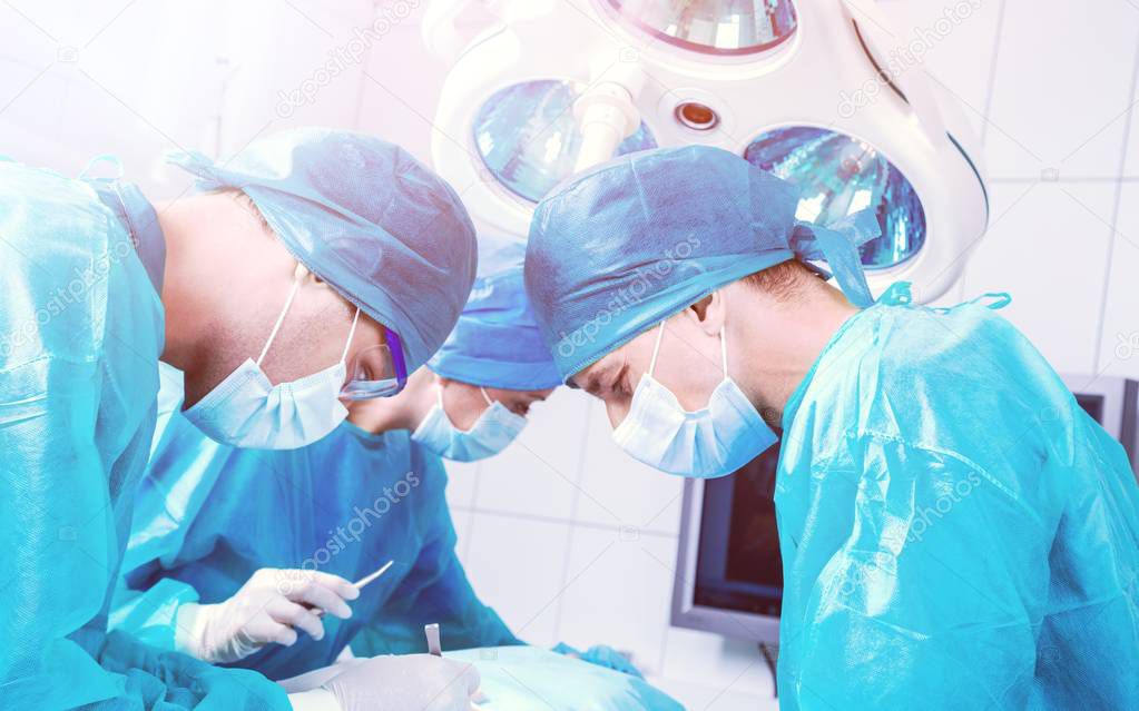 young surgeons in operation room.