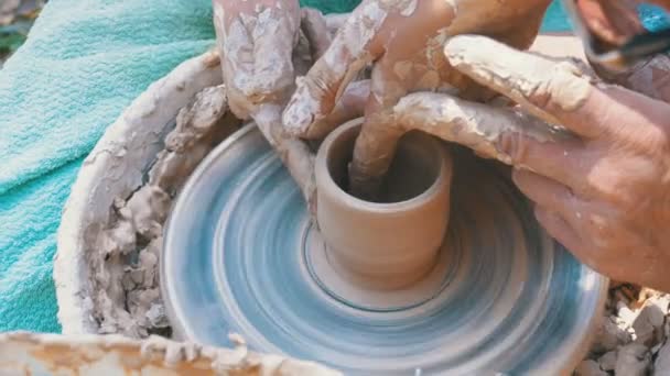 Man and Woman Potters Hands Work with Clay on a Potters Wheel. — Stock Video