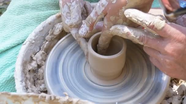 Potters Hands Work with Clay on a Potters Wheel — Stock Video