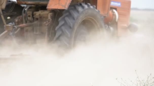 Old tractor plowing field. Slow Motion — Stock Video