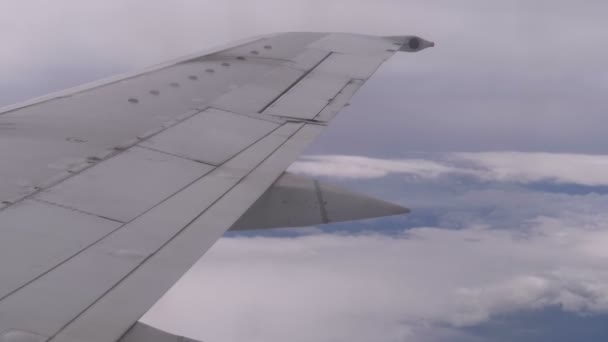 View from the Passenger Airplane Window on the Wing Flying above the Clouds — Stock Video