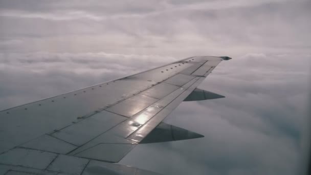 View from the Passenger Airplane Window on the Wing Flying above the Clouds — Stock Video