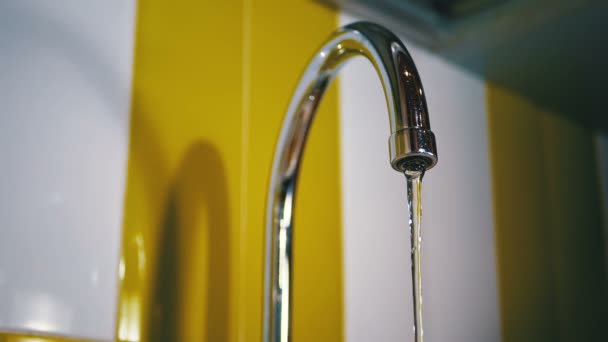 Water Running from the Tap into a Sink. Slow Motion — Stock Video