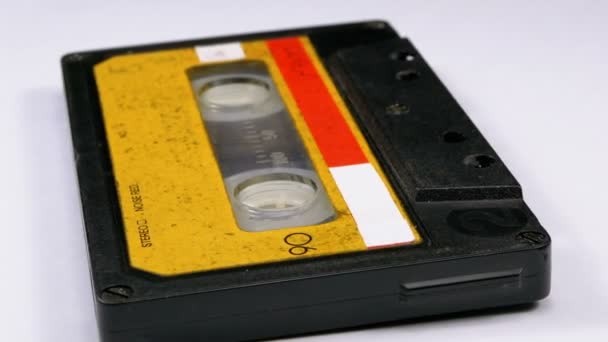 Audio Cassette Rotates on White Background — Stock Video