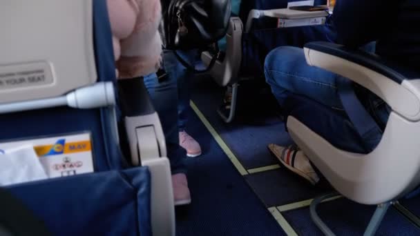 Passengers Inside the Cabin of Passenger Aircraft Sitting on the Chairs During the Flight — Stock Video