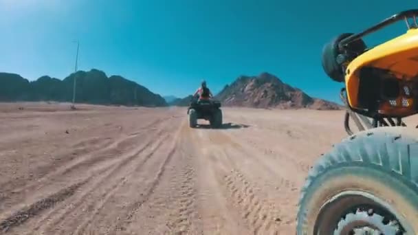 Driving of the ATV in the Desert of Egypt. Extreme view of the wheel off-road vehicle — Stock Video