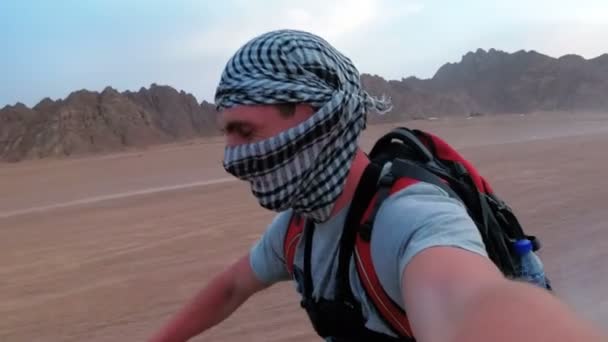 Man is Riding a Quad Bike in Desert of Egypt and Shooting Himself on an Action Camera — Stock Video