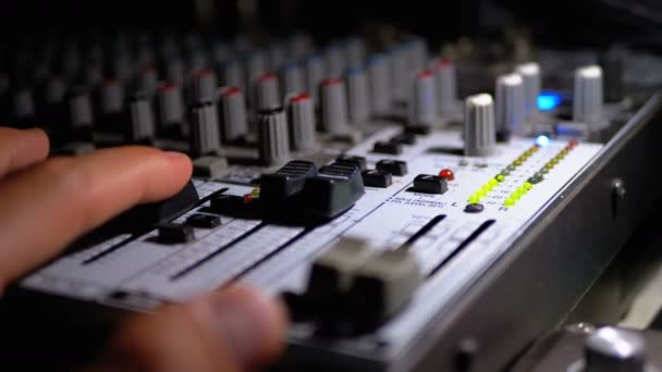 Mans hand Working with Sound Mixing Console. LED Signal Strength Indicators — Stock Video