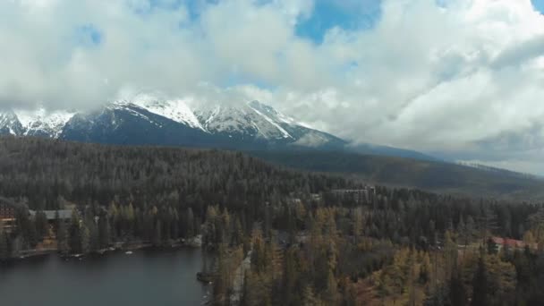 Aerial view of Strbske Pleso in the Clouds and Snowy Mountains. Slovakia — Stock Video