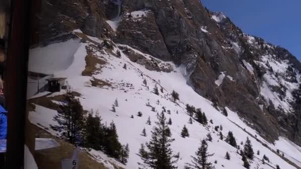 Narrow Gauge Cogwheel Tourist Train Rides in the Snowy Mountains. Switzerland, Alps — Stock Video