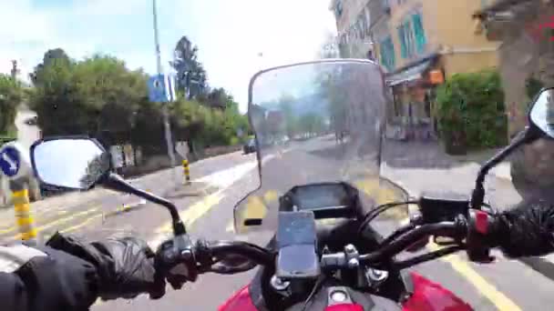Motorcyclist riding a motorcycle rides through the streets of Montreux, Switzerland. — Stock Video
