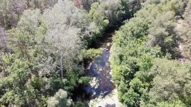 Kayaking and Canoeing along the Riverbed Aerial View. Rafting. Tracking a Boat — Stock Video
