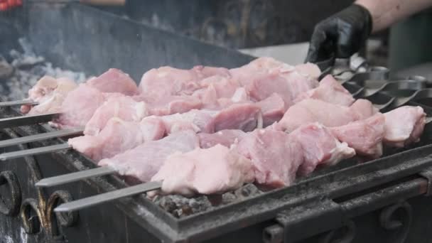 Raw Meat on Skewers is Cooked on Grill at Street Food Festival. Slow Motion — Stock Video