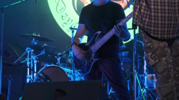 Bass Guitarist at a Rock Concert Plays Guitar on Open Stage. Slow Motion — Stock Video