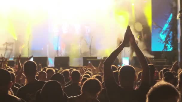 Crowd of Fans at Live Rock Concert Raise Hands and Dance (en inglés). Moción lenta 240 fps — Vídeos de Stock