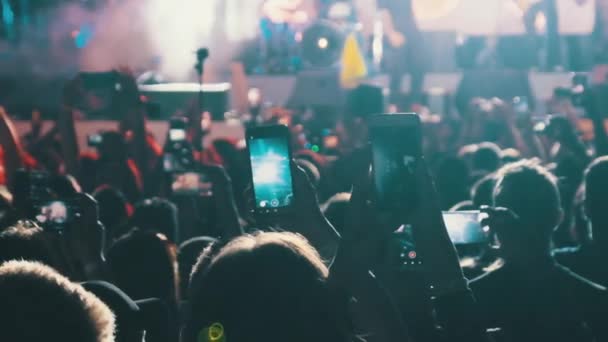 Silhouette of Crowd Making Video with Smartphone at Live Rock Concert. Slow Motion — Stock Video