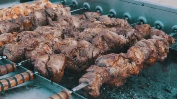 Shish Kebab on Skewers is Cooked on the Automatic Grill at Street Food Festival. — Stock Video