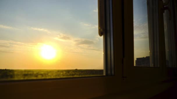 Sunset view through the Window. Bright Yellow Sun Moves over Horizon. Time Lapse — Stock Footage Sunset view through the Window. Bright Yellow Sun Moves over Horizon. Time Lapse Stock Video